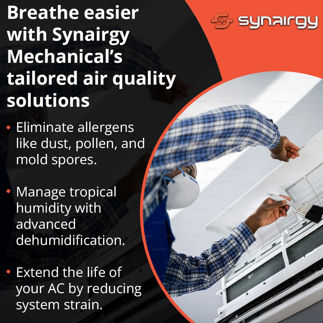 Technician cleaning air conditioner unit to improve indoor air quality and reduce allergens